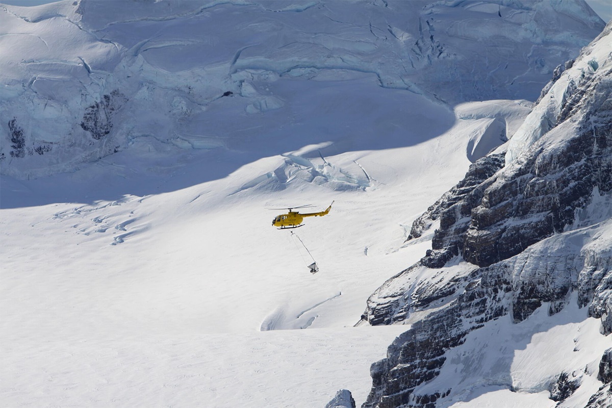 Phase I. Helicopter over icecap close. Credit - Tony Martin